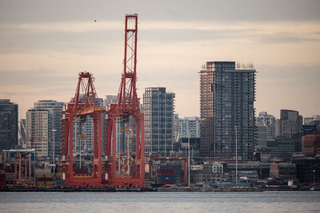 Cranes and condo towers along the Vancouver waterfront, representing homebuilding and infrastructure investment