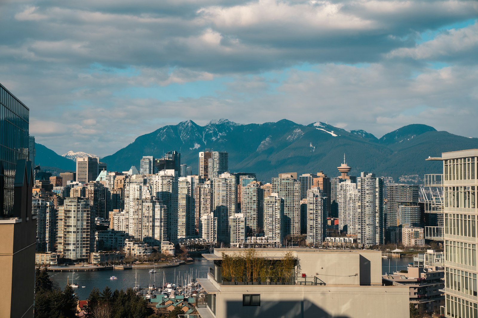 False Creek condo towers and the North Shore mountains, illustrating Metro Vancouver presale housing