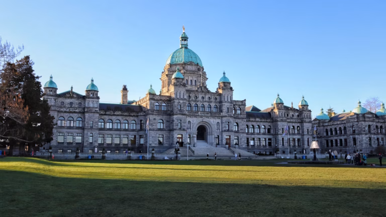 The BC Legislature building in Victoria under a clear blue sky